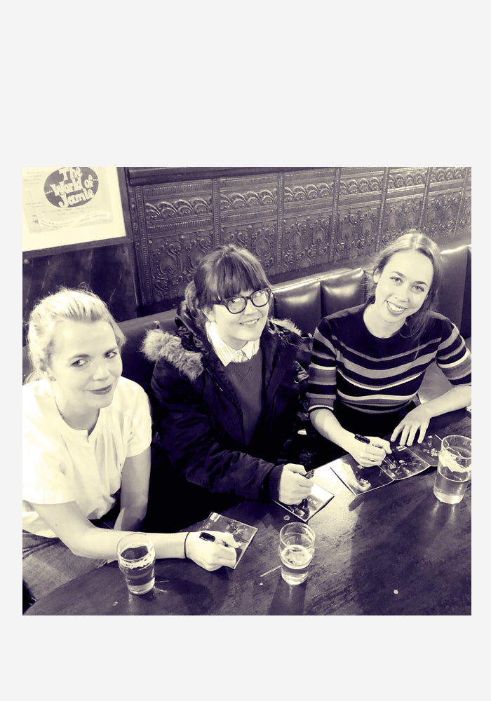 Photo of I'm With Her signing CD booklets for the See You Around album